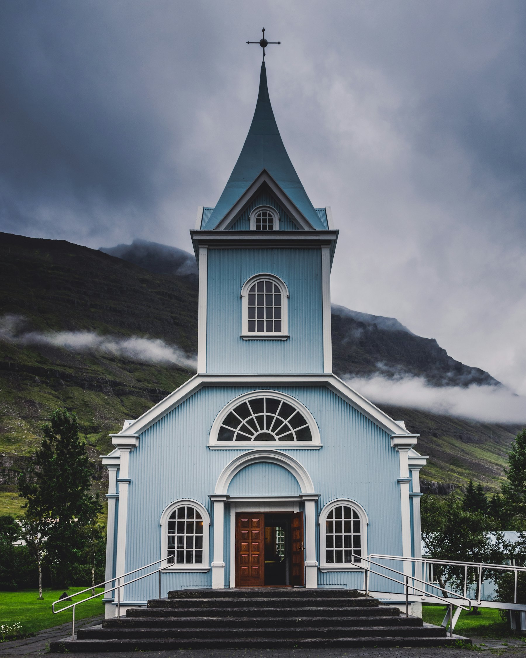 A small church beneath a mountain